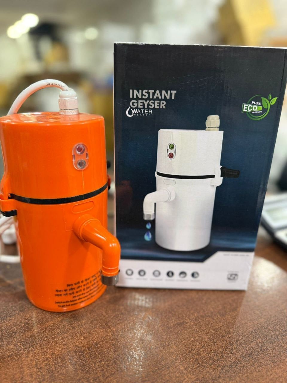 portable instant electric water geyser or mini instant water heater.